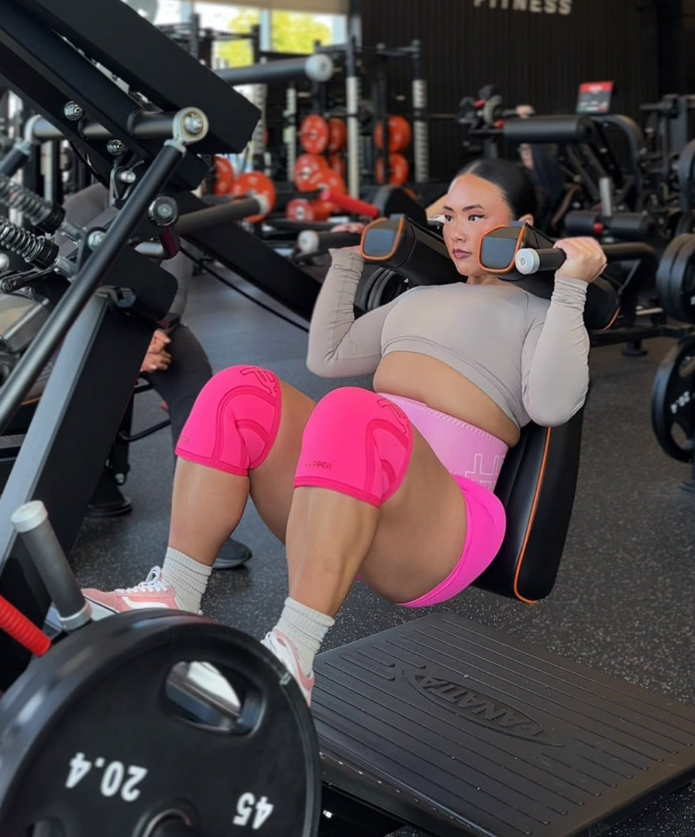 woman strength training with uppper lifting gear