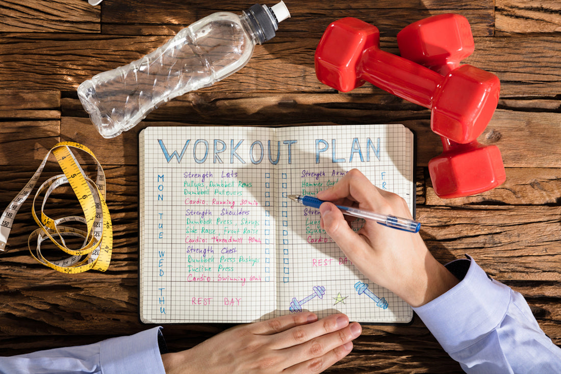 woman writing workout plan